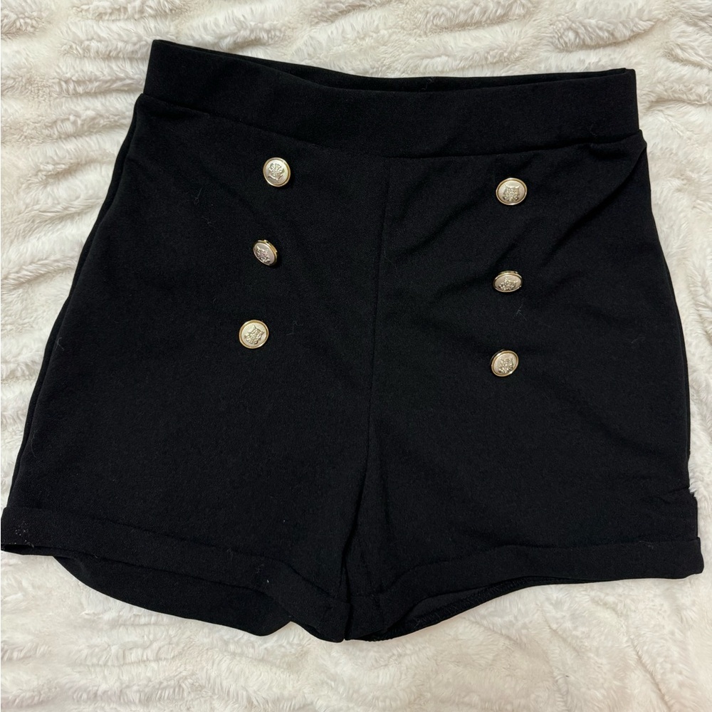 Black shorts with gold buttons